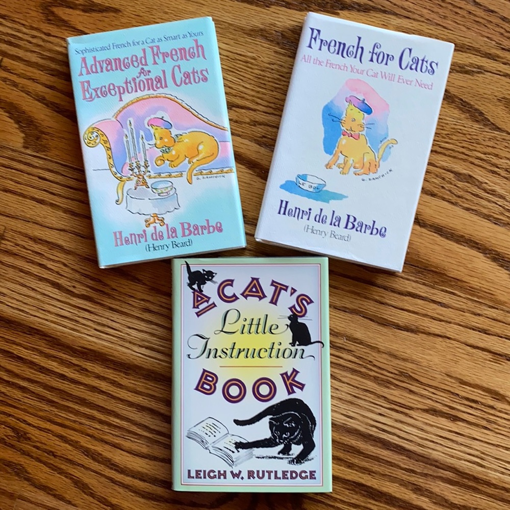 Trio of cat books - like new condition
